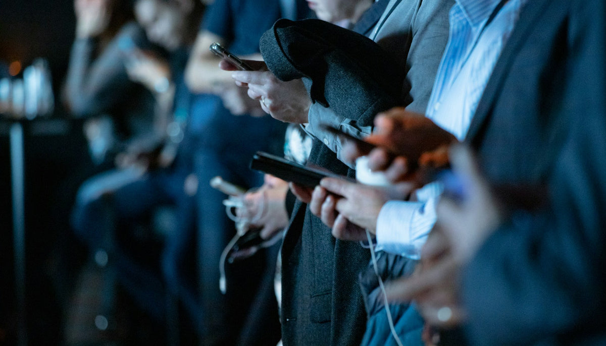 people using phone while standing