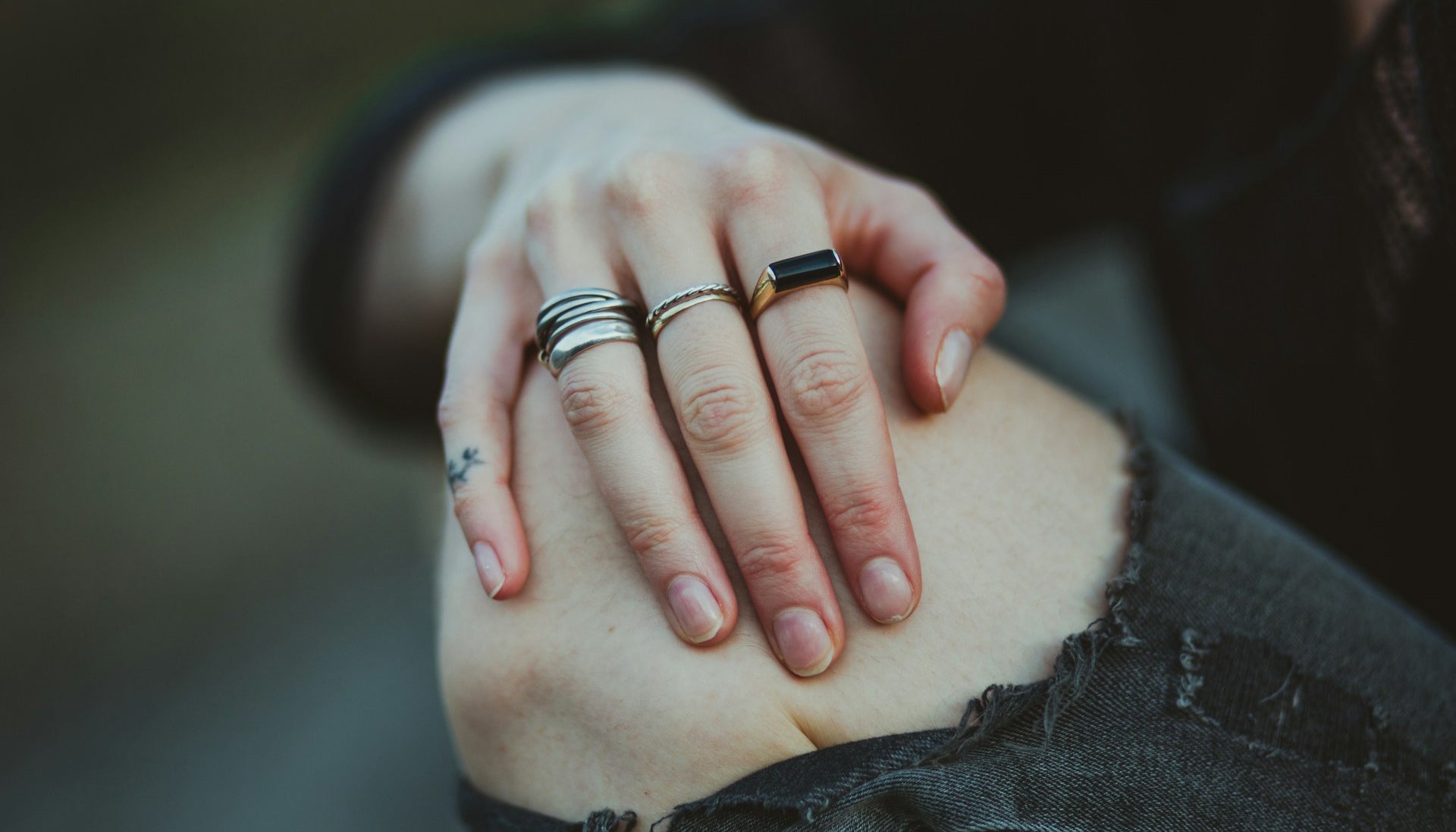 photo of person showing stackable fashion rings